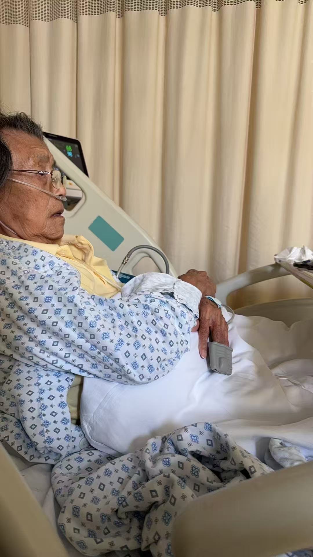Elder family member recovering in a hospital bed